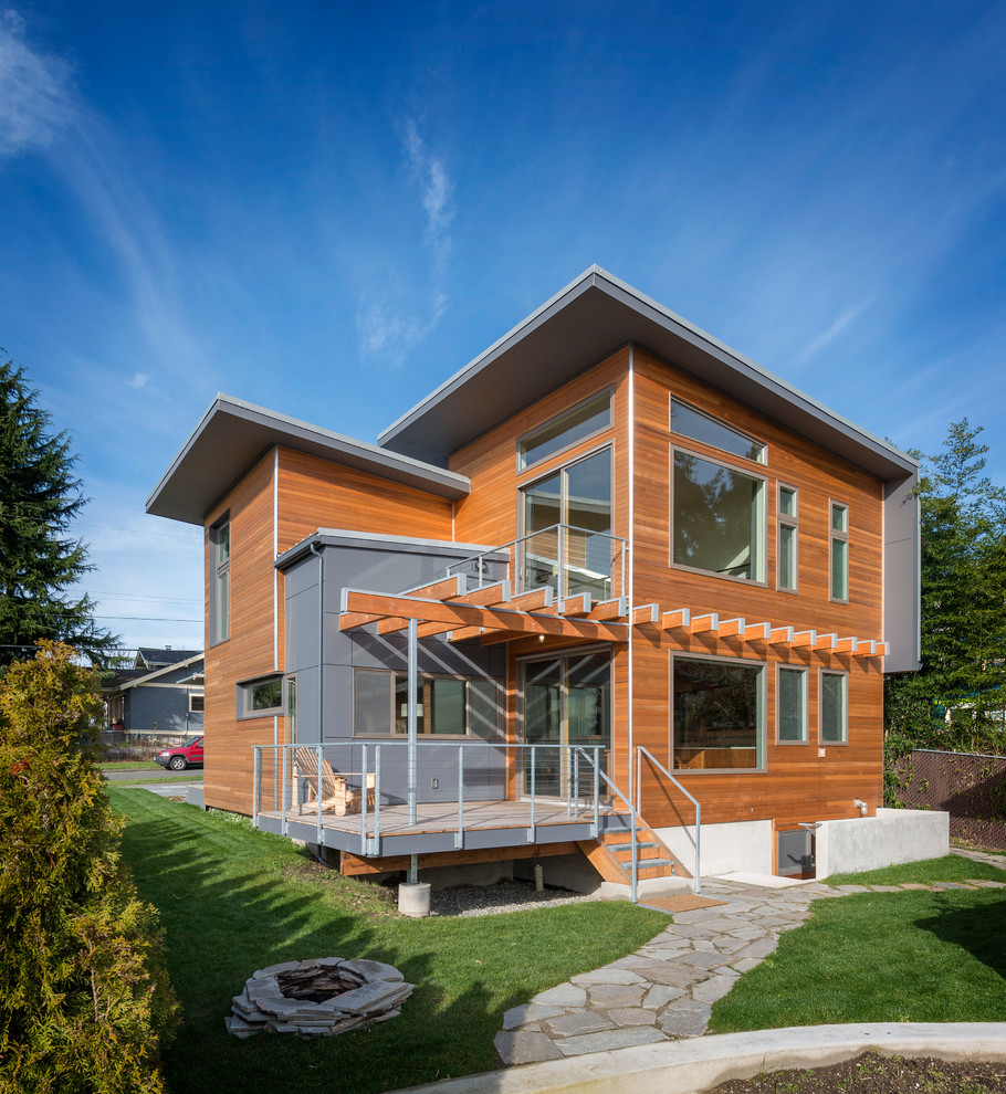 Design ideas for a contemporary two-storey exterior in Seattle with wood siding.