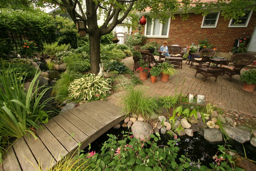 This is an example of a traditional garden in Chicago with a water feature.