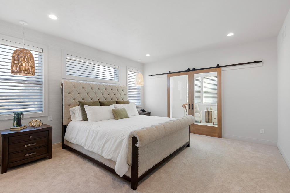 Example of a large transitional master carpeted and white floor bedroom design with white walls