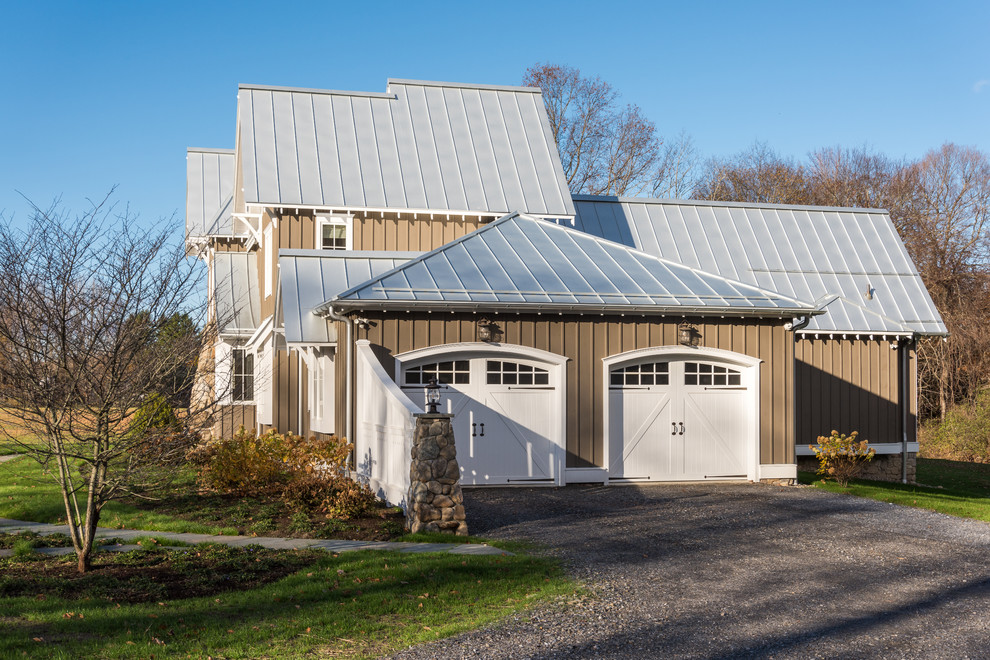 Design ideas for a mid-sized country attached two-car garage in New York.