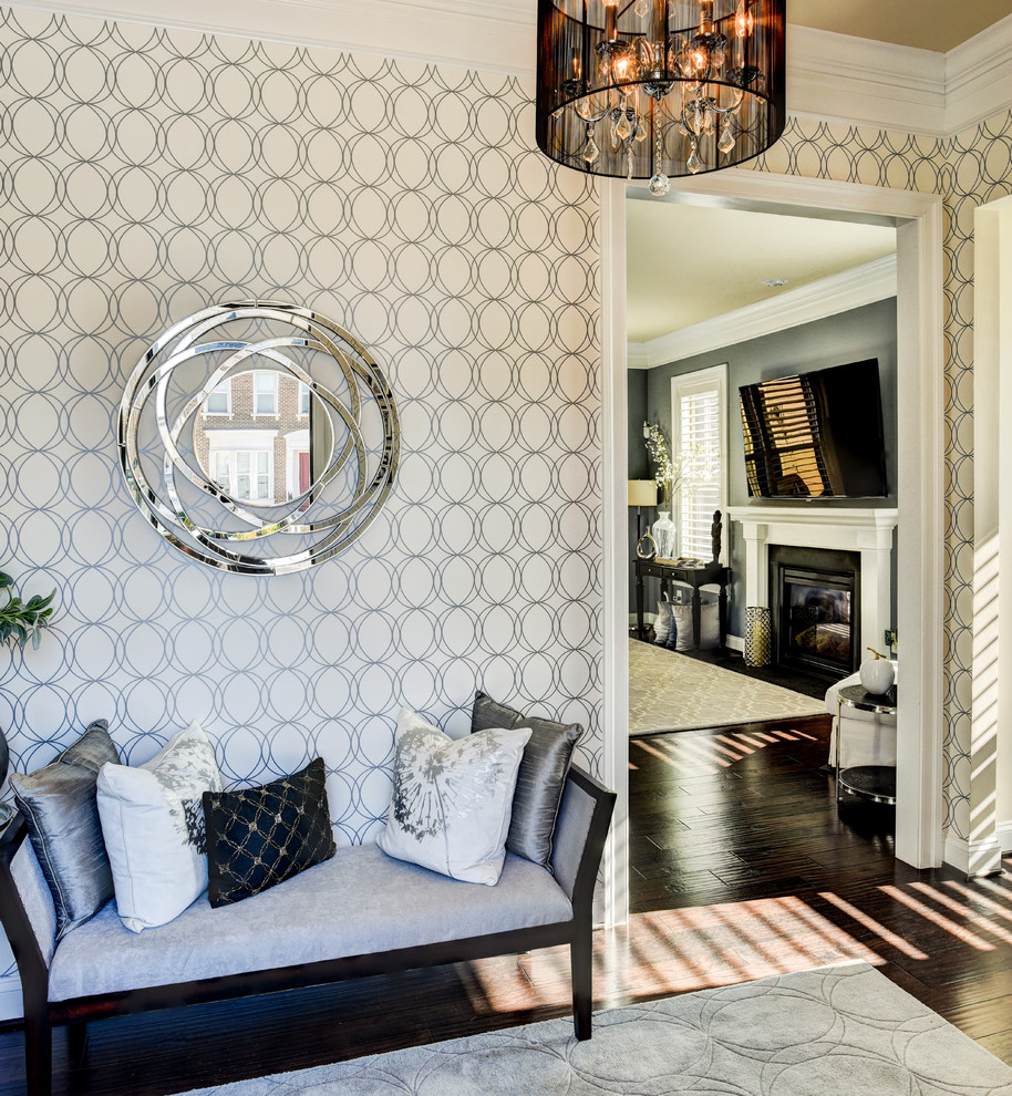 Example of a transitional dark wood floor entryway design in DC Metro with white walls