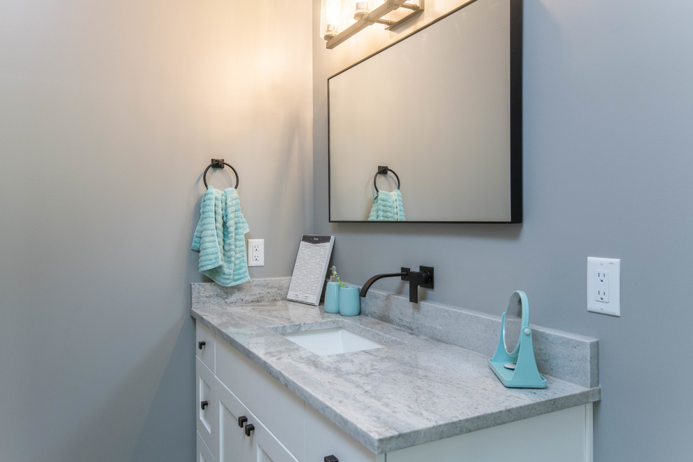 Photo of a mid-sized beach style kids bathroom in Other with shaker cabinets, white cabinets, grey walls, an undermount sink, granite benchtops and grey benchtops.