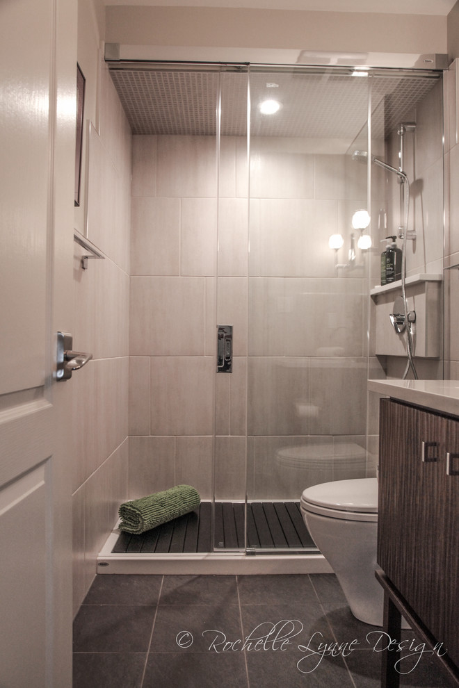 Inspiration for a small contemporary bathroom in Calgary with an undermount sink, flat-panel cabinets, dark wood cabinets, engineered quartz benchtops, an alcove shower, beige tile, porcelain tile, white walls and porcelain floors.