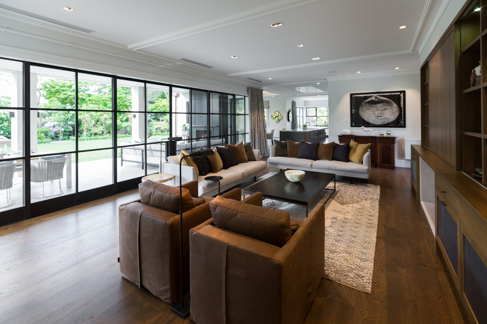 Design ideas for a contemporary formal open concept living room in Christchurch with medium hardwood floors, a built-in media wall, brown floor, brown walls, a standard fireplace and a stone fireplace surround.