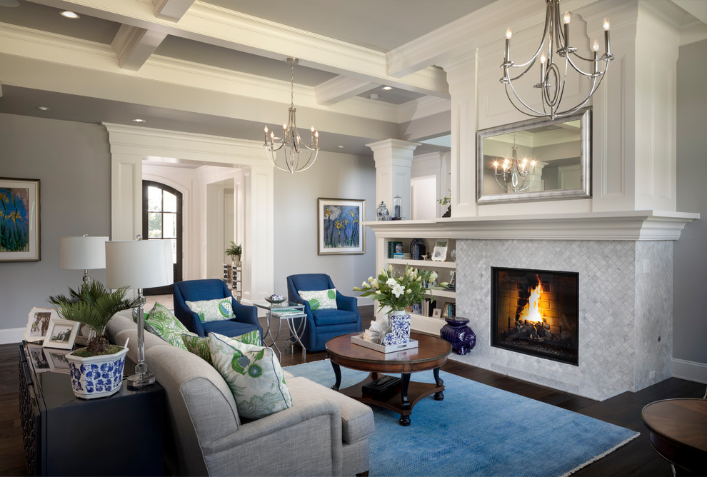 Inspiration for a large transitional formal open concept living room in Portland with grey walls, medium hardwood floors, a standard fireplace, a tile fireplace surround, a wall-mounted tv and brown floor.