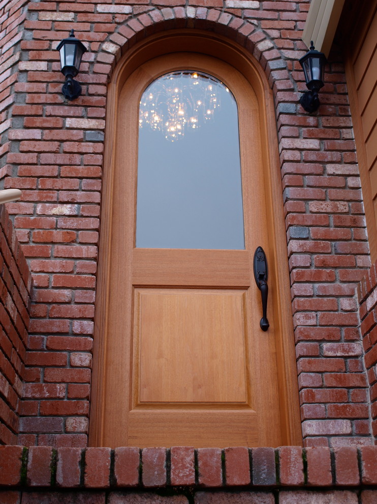 Mid-sized contemporary front door in San Francisco with a single front door and a medium wood front door.