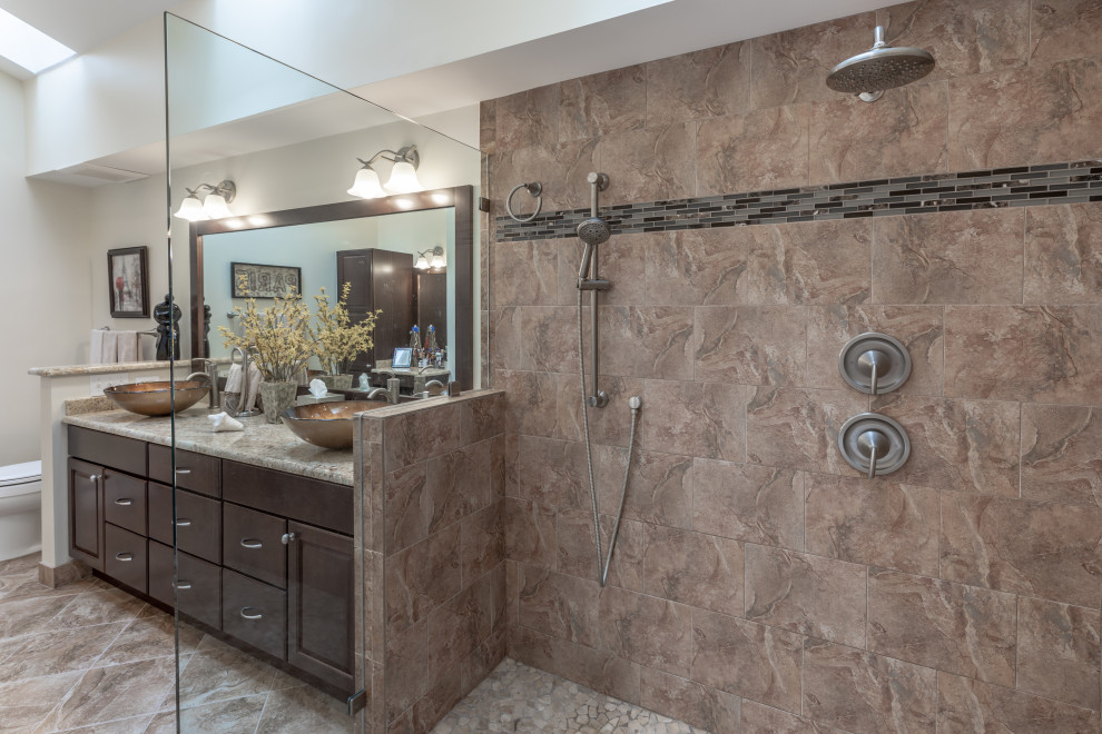 Design ideas for a small contemporary ensuite bathroom in DC Metro with brown cabinets, a freestanding bath, a walk-in shower, a one-piece toilet, beige walls, a vessel sink, grey floors, brown worktops, double sinks and a built in vanity unit.