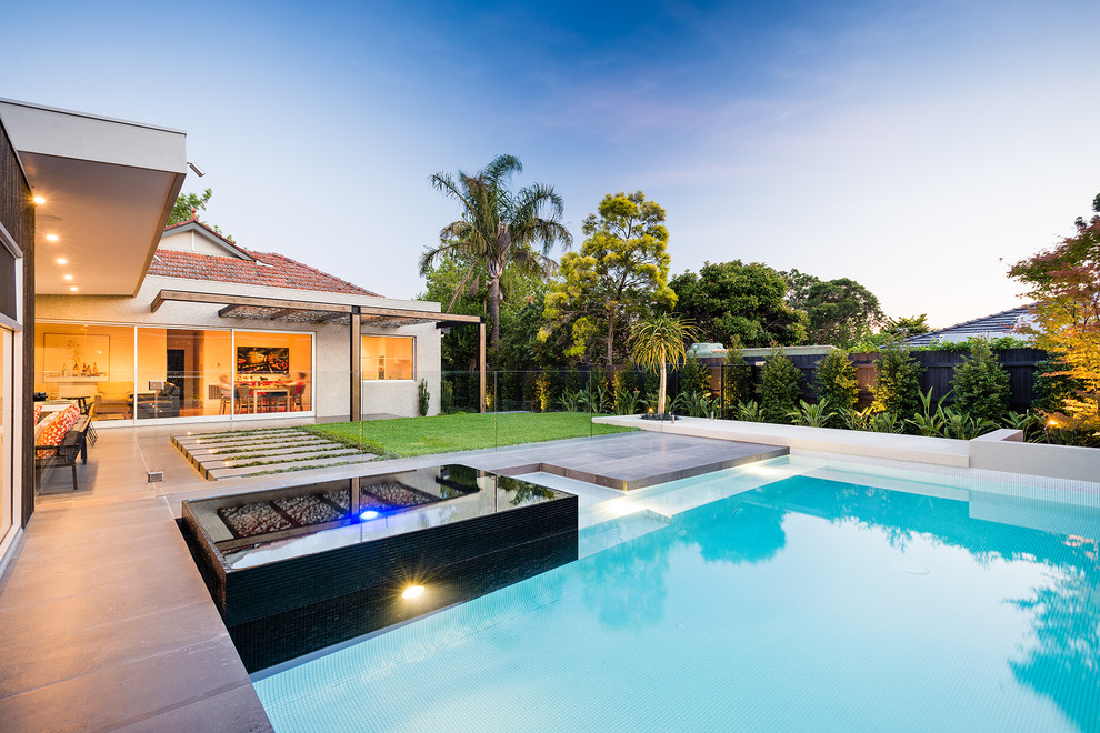This is an example of a contemporary backyard pool in Melbourne.