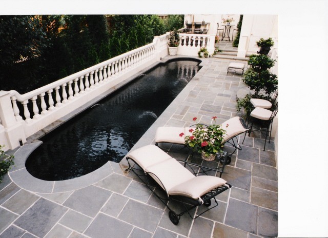 Inspiration for a mid-sized rustic backyard concrete and custom-shaped pool fountain remodel in Atlanta