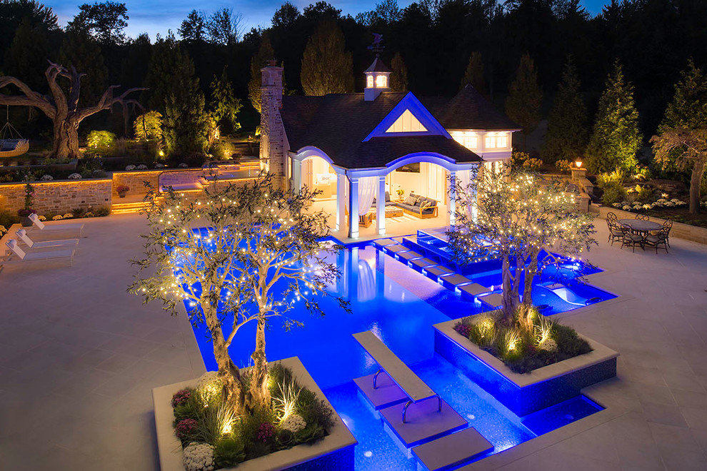 Inspiration for a transitional backyard pool in Cleveland with a pool house.