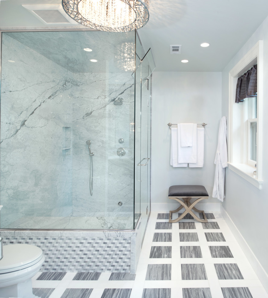 Photo of a large transitional bathroom in Kansas City with an undermount sink, a two-piece toilet, gray tile, stone tile, grey walls, marble floors and with a sauna.