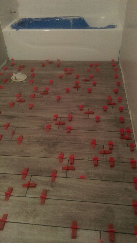 how do I determine what direction to lay rectangular floor tile in my