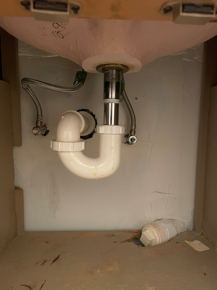 Extra capped pipe under bathroom sink