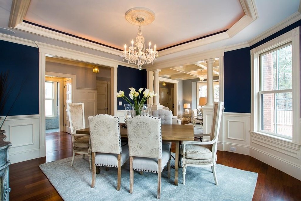 Inspiration for a large traditional kitchen/dining combo in Boston with blue walls, medium hardwood floors, no fireplace and brown floor.