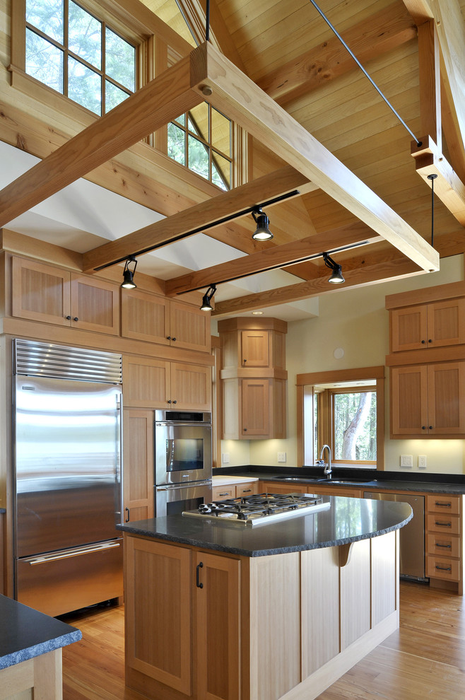 Design ideas for a country u-shaped kitchen in Seattle with stainless steel appliances, shaker cabinets and medium wood cabinets.