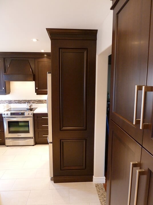 Inspiration for a transitional porcelain tile and beige floor eat-in kitchen remodel in Toronto with a double-bowl sink, shaker cabinets, dark wood cabinets, quartz countertops, white backsplash, subway tile backsplash, stainless steel appliances and white countertops