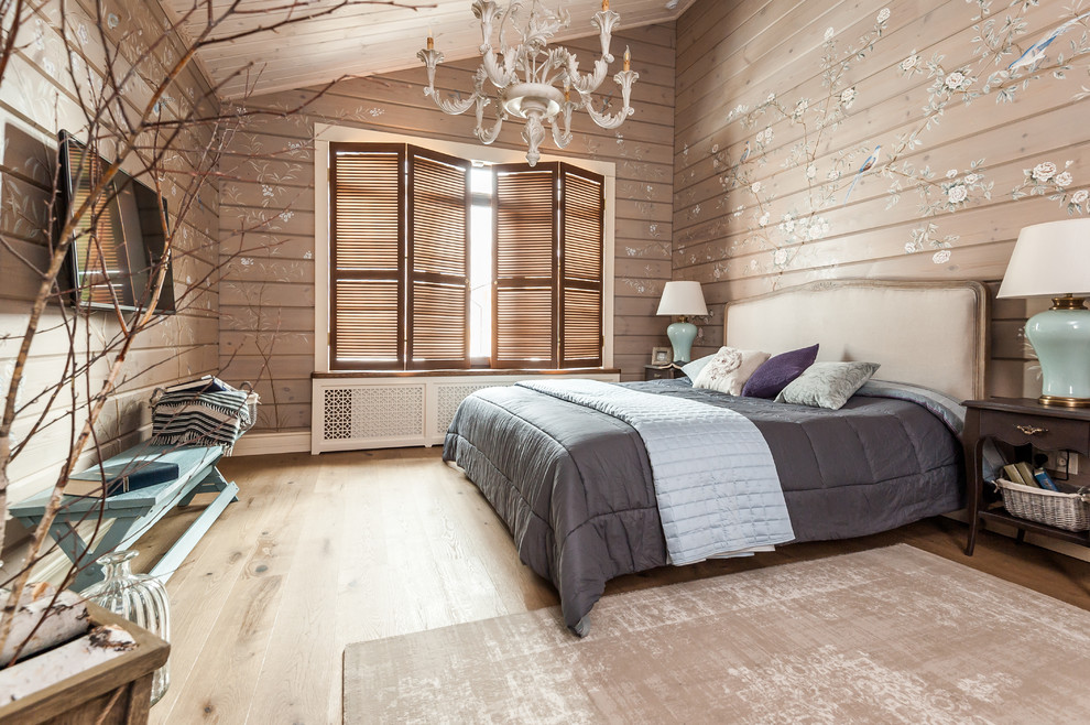 Design ideas for a mid-sized country master bedroom in Other with beige walls, light hardwood floors, beige floor, wood and wood walls.