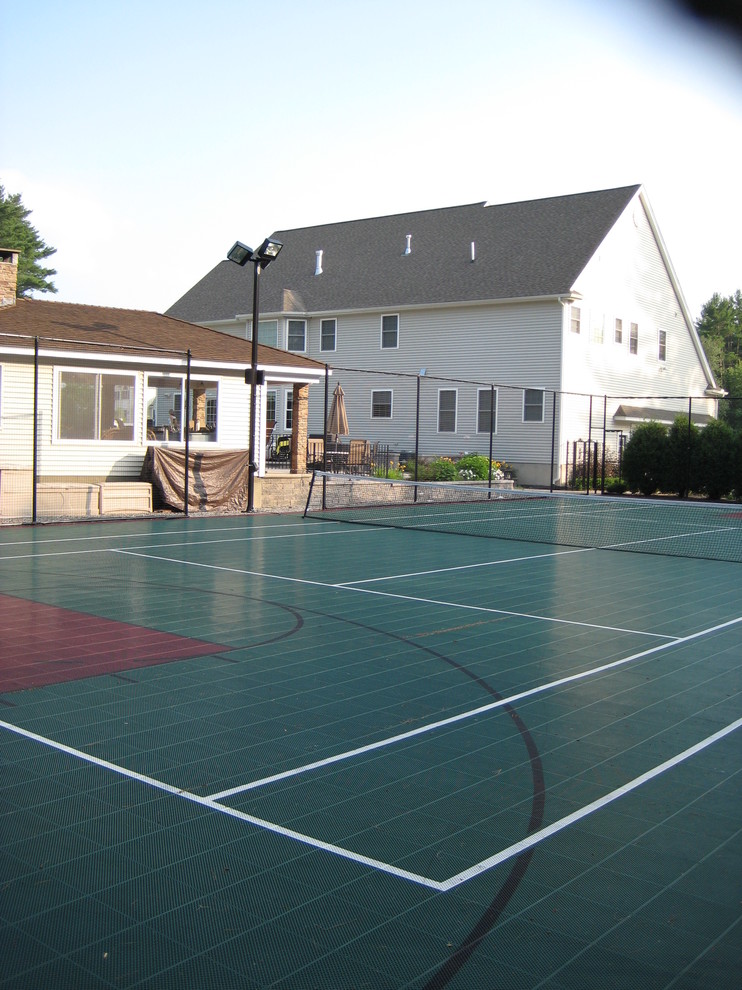 Large traditional backyard partial sun outdoor sport court in Boston with concrete pavers.