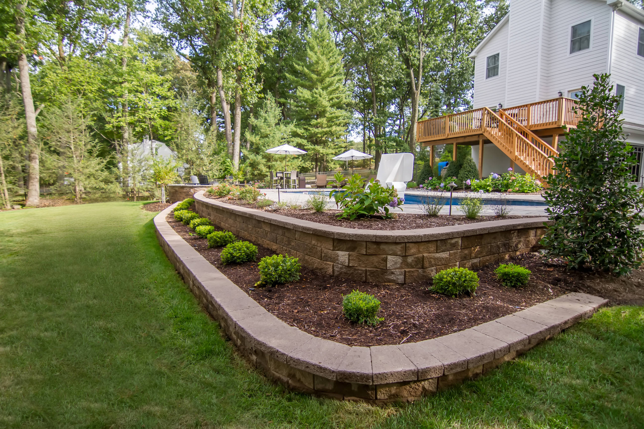 Creating a pool area on a sloped backyard