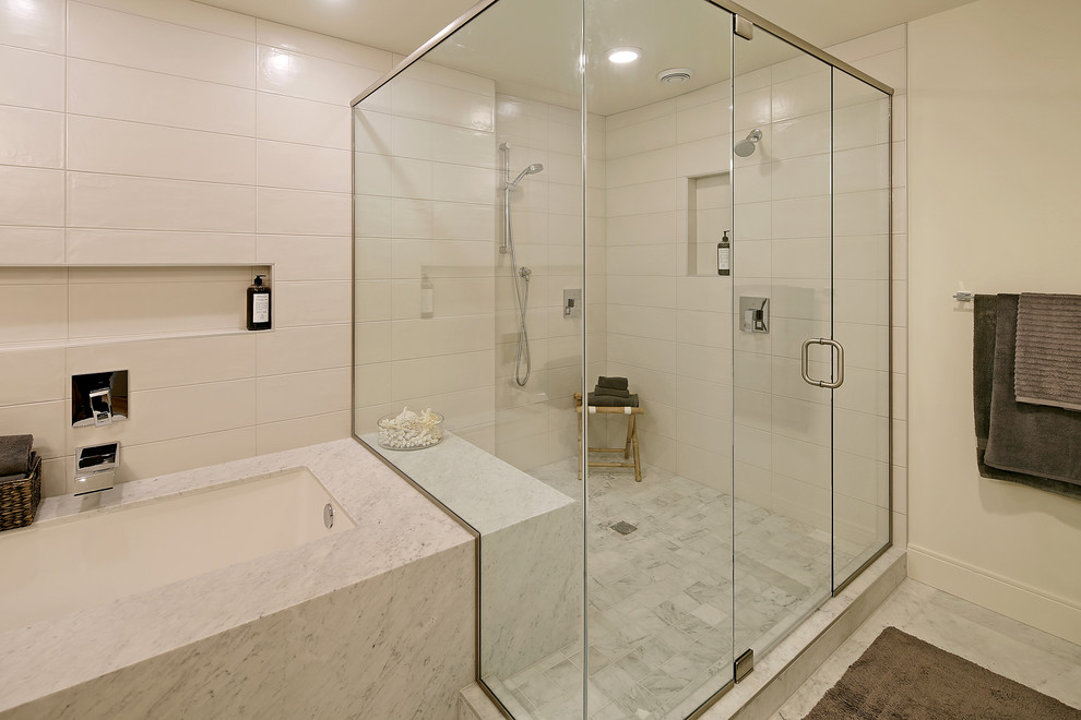 This is an example of a contemporary bathroom in Seattle with a hinged shower door.