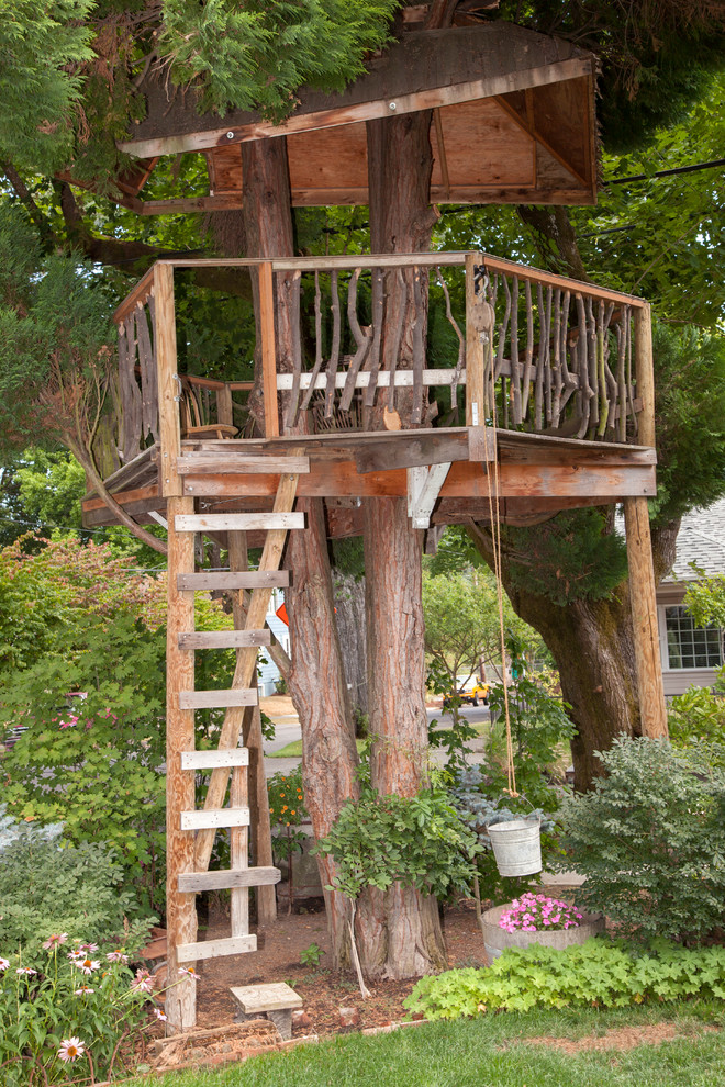 Eclectic garden in Portland with with outdoor playset.