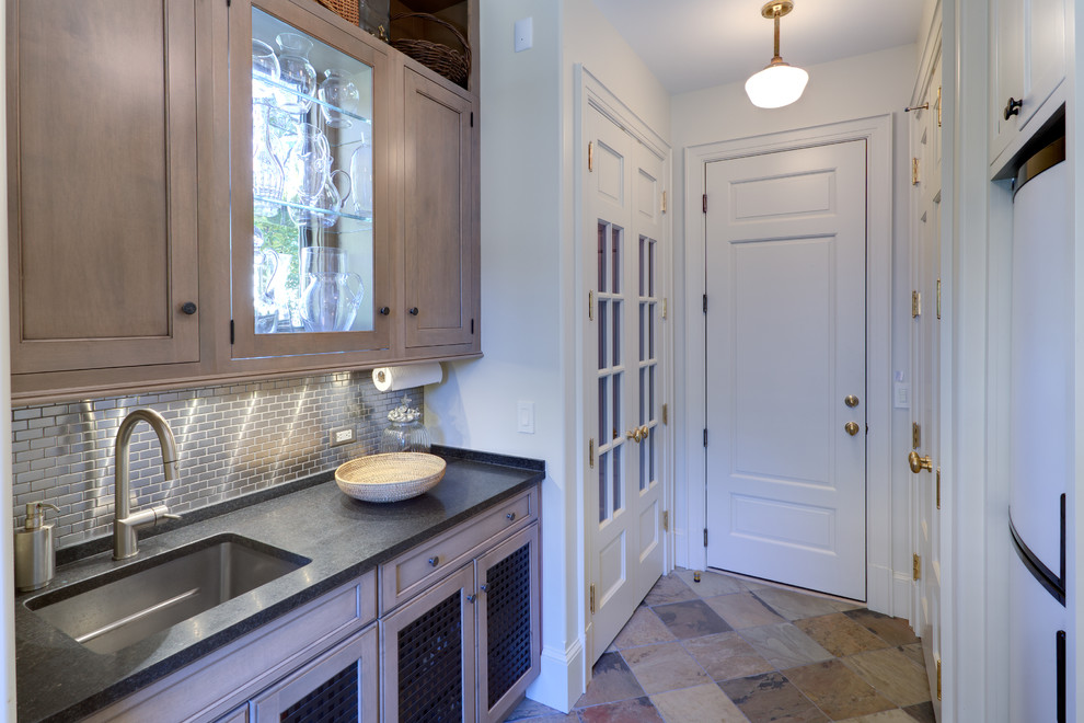 Inspiration for a traditional kitchen pantry in DC Metro with an undermount sink, recessed-panel cabinets, light wood cabinets, metallic splashback, metal splashback and slate floors.