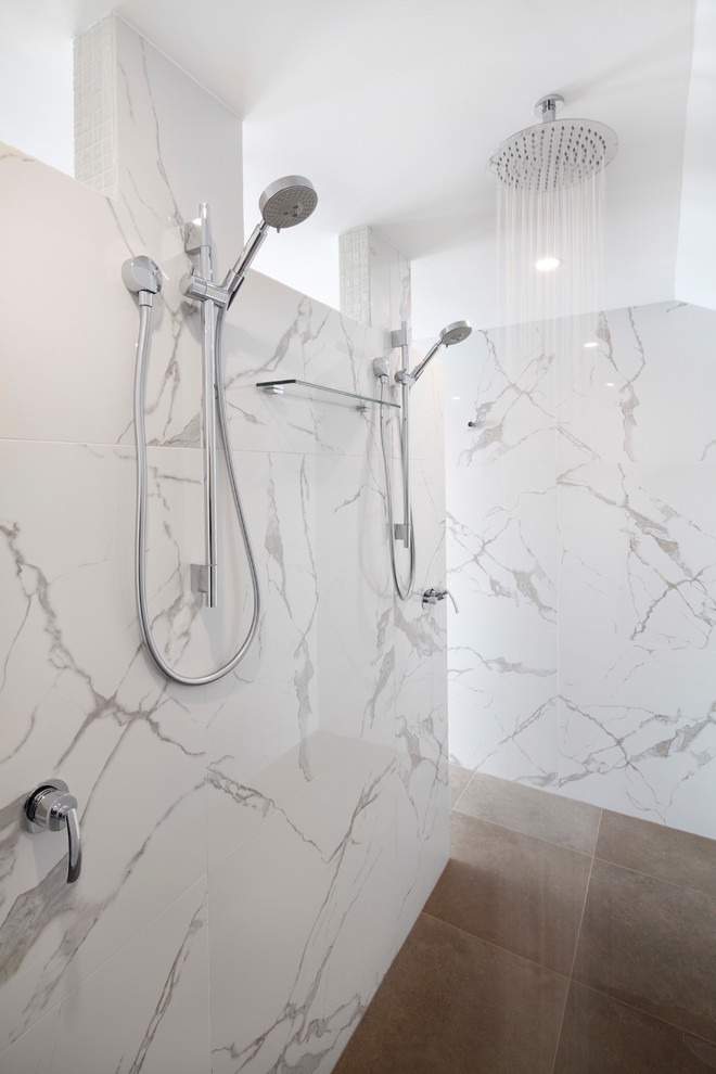 Design ideas for a large modern master bathroom in Sydney with flat-panel cabinets, grey cabinets, a one-piece toilet, a vessel sink, solid surface benchtops and grey floor.