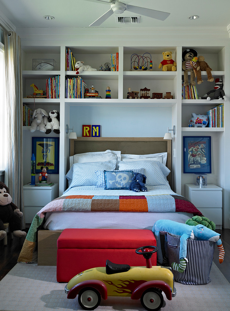 Design ideas for a transitional kids' room for boys in Miami with blue walls and dark hardwood floors.