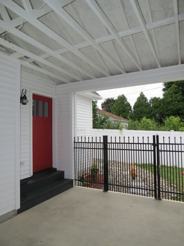 Example of a small transitional attached one-car home design design in Boston