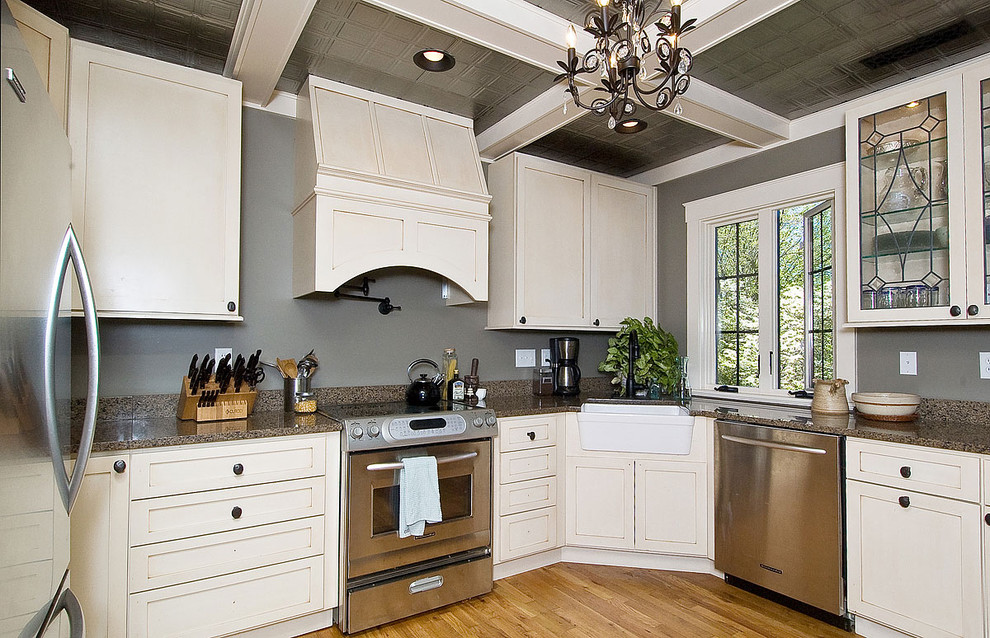 Traditional kitchen in Other with stainless steel appliances and granite benchtops.