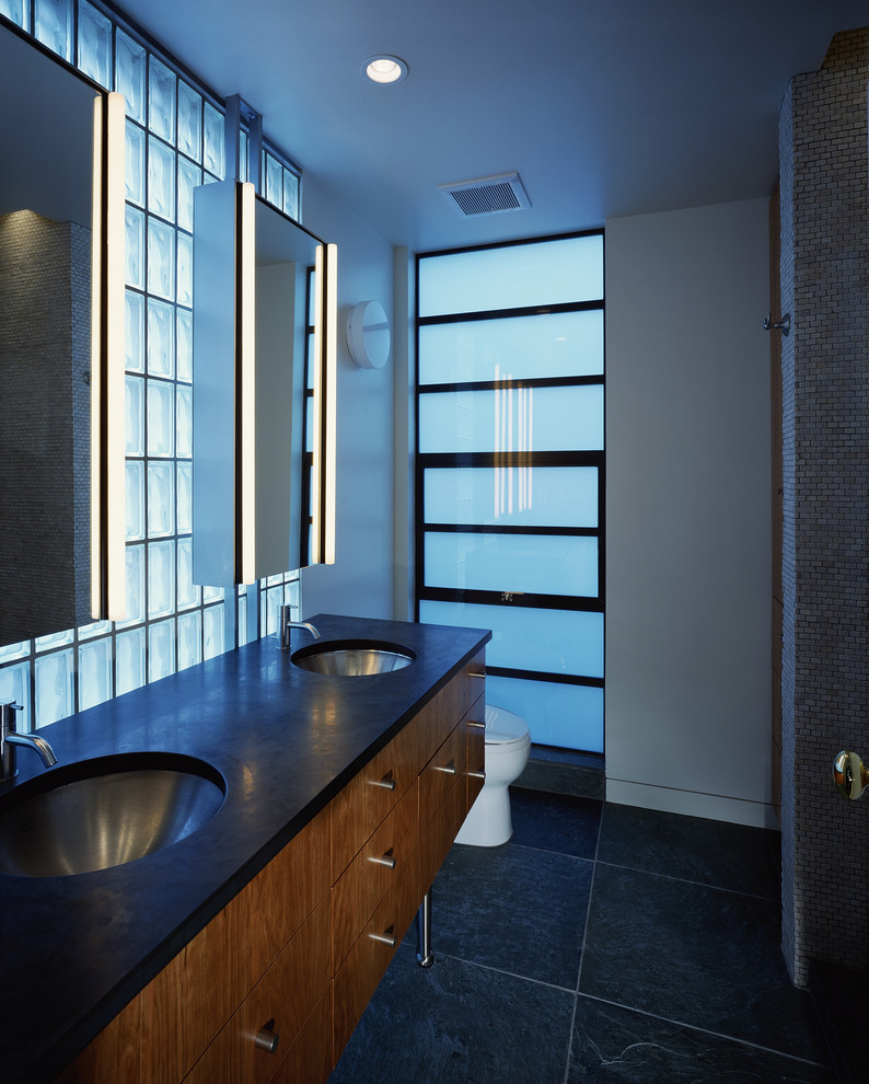 Minimalist gray tile bathroom photo in San Francisco with an undermount sink, flat-panel cabinets and medium tone wood cabinets