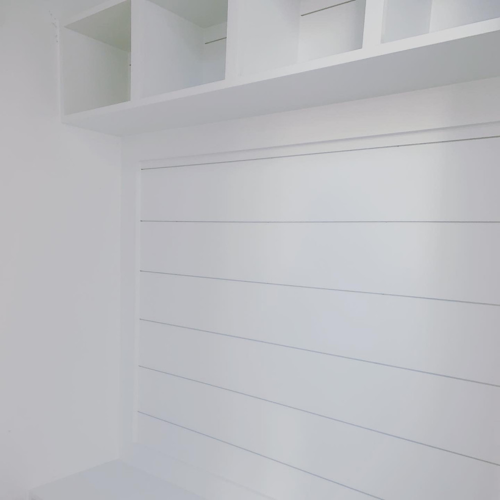 Example of a large transitional mudroom design