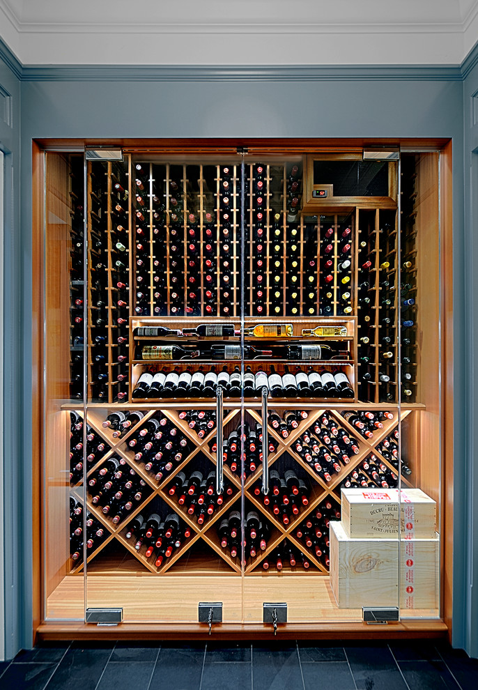 Inspiration for a small contemporary wine cellar in Chicago with slate floors, display racks and grey floor.