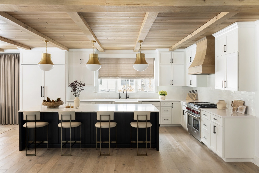 Luxurious Kitchen with White Cabinets and Gold Pendant Lights ...