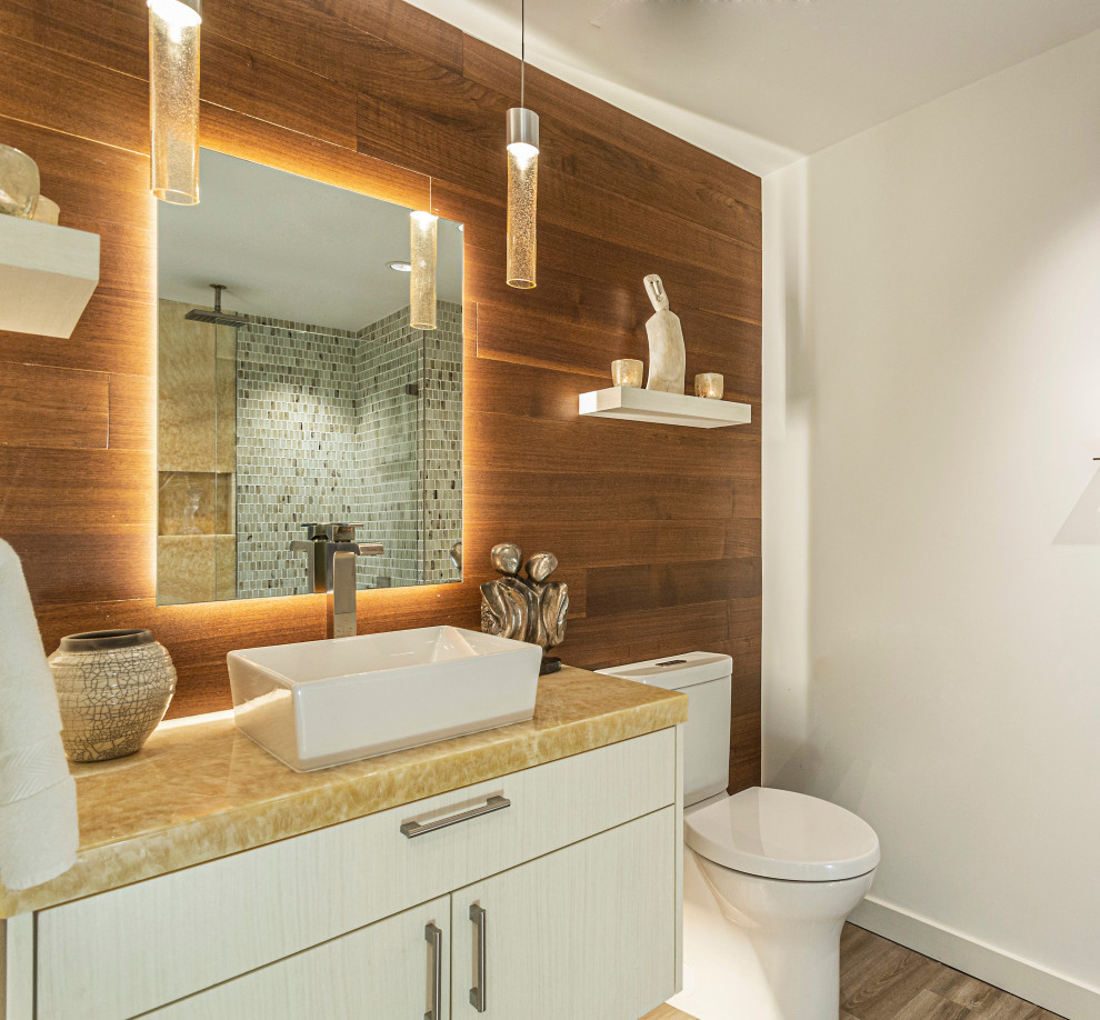 Mid-sized bathroom in San Diego with flat-panel cabinets, white cabinets, vinyl floors, a vessel sink, onyx benchtops, yellow benchtops, a single vanity and a floating vanity.
