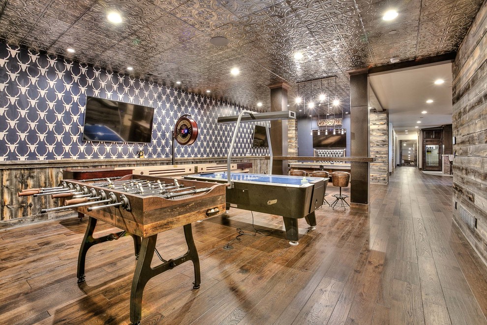 Inspiration for a huge rustic look-out medium tone wood floor basement remodel in Denver with blue walls and no fireplace
