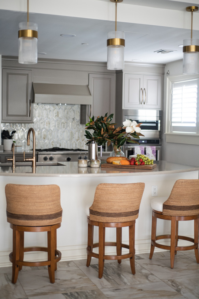 Small kitchen photo with beige cabinets and stainless steel appliances