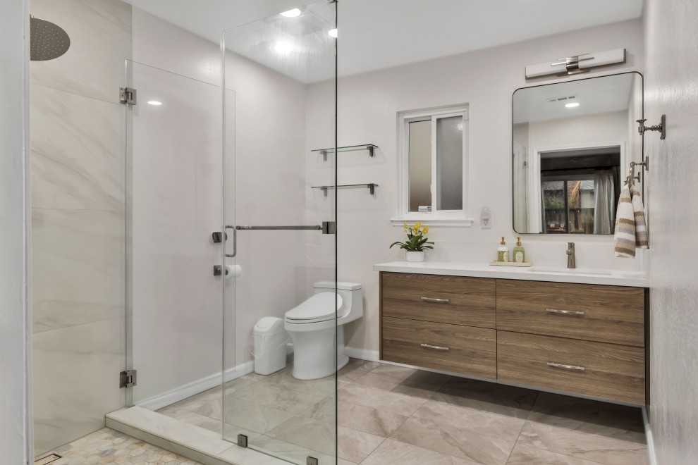 Small 1960s 3/4 gray tile and ceramic tile ceramic tile, gray floor, double-sink and brick wall alcove shower photo in Seattle with flat-panel cabinets, brown cabinets, a two-piece toilet, gray walls, an undermount sink, quartz countertops, a hinged shower door, white countertops and a floating vanity