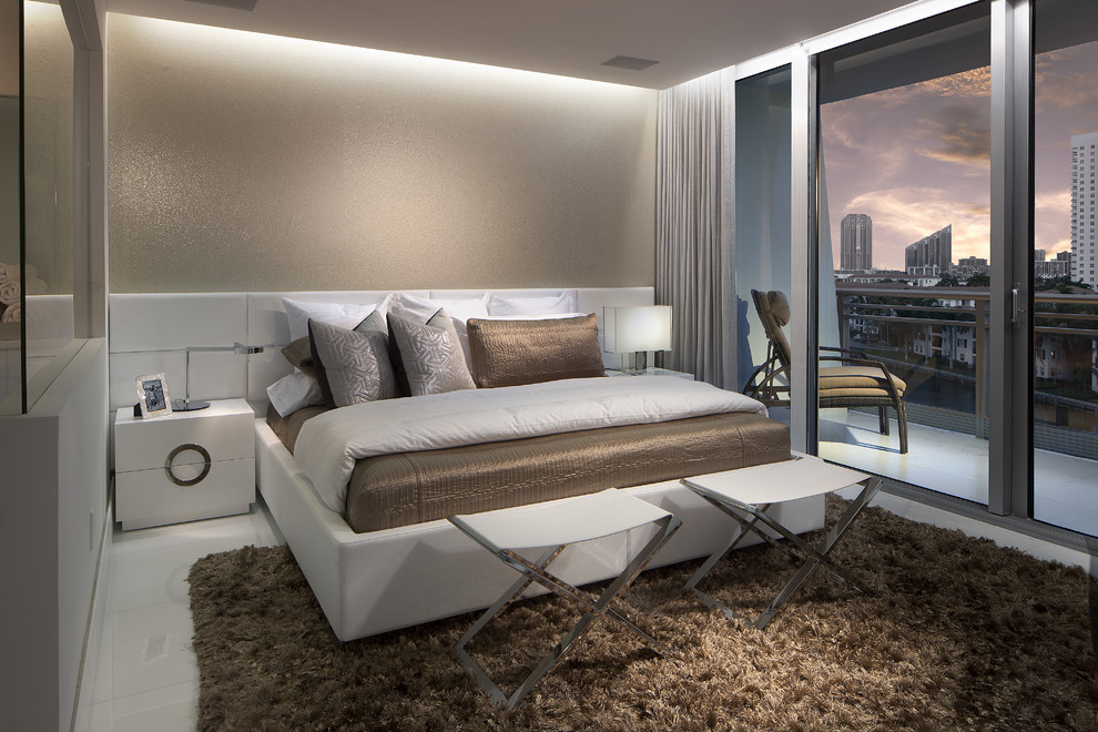 Design ideas for a small contemporary master bedroom in Miami with beige walls and porcelain floors.