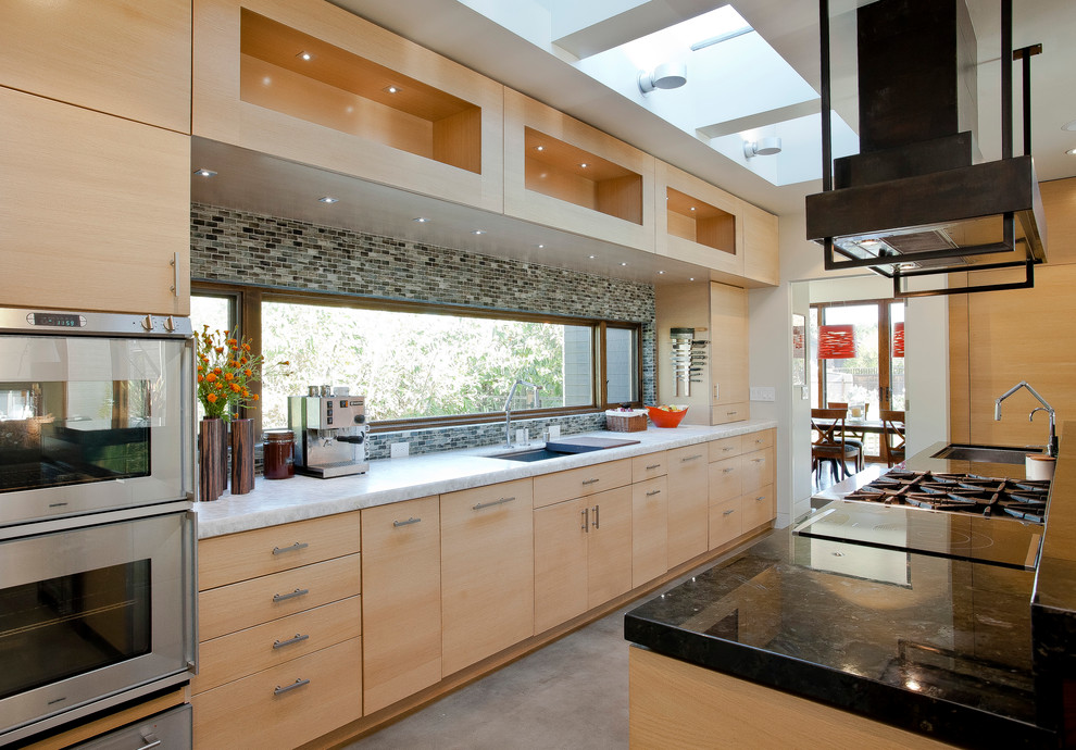Design ideas for a contemporary kitchen in San Francisco with stainless steel appliances and marble benchtops.
