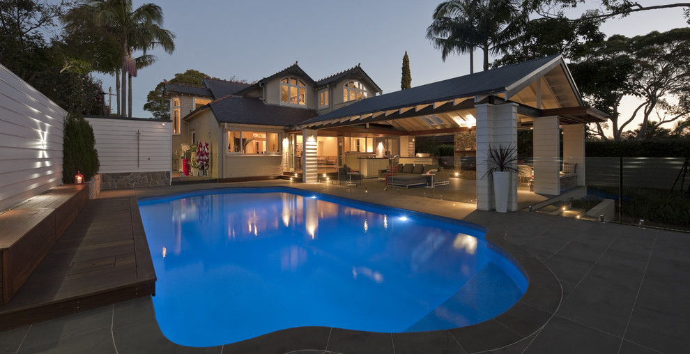 Design ideas for a large contemporary backyard pool in Sydney.