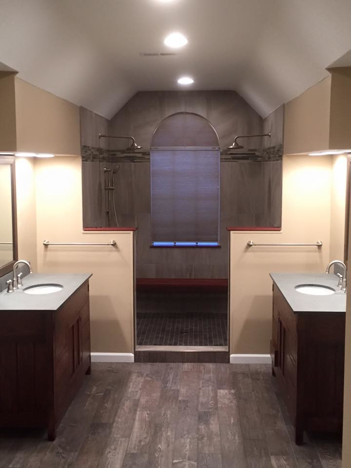 Photo of a large traditional master bathroom in Cincinnati with flat-panel cabinets, dark wood cabinets, an open shower, gray tile, porcelain tile, beige walls, dark hardwood floors, an undermount sink and engineered quartz benchtops.