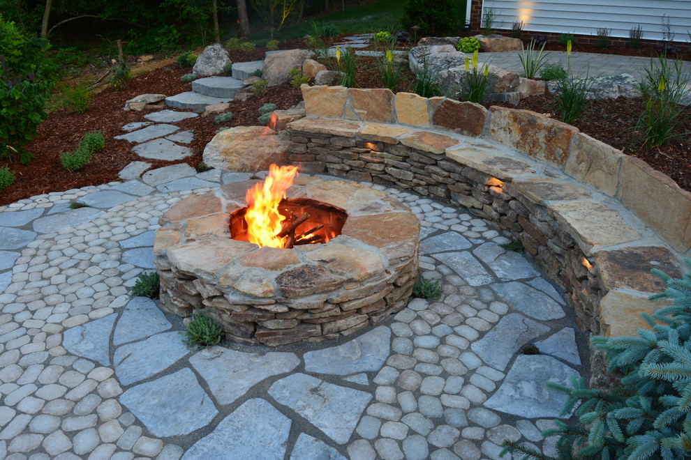 Inspiration for a mid-sized rustic backyard concrete paver patio remodel in Richmond with a fire pit and no cover