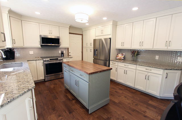 Cream Kitchen With Green Island With Butcher Block Countertop