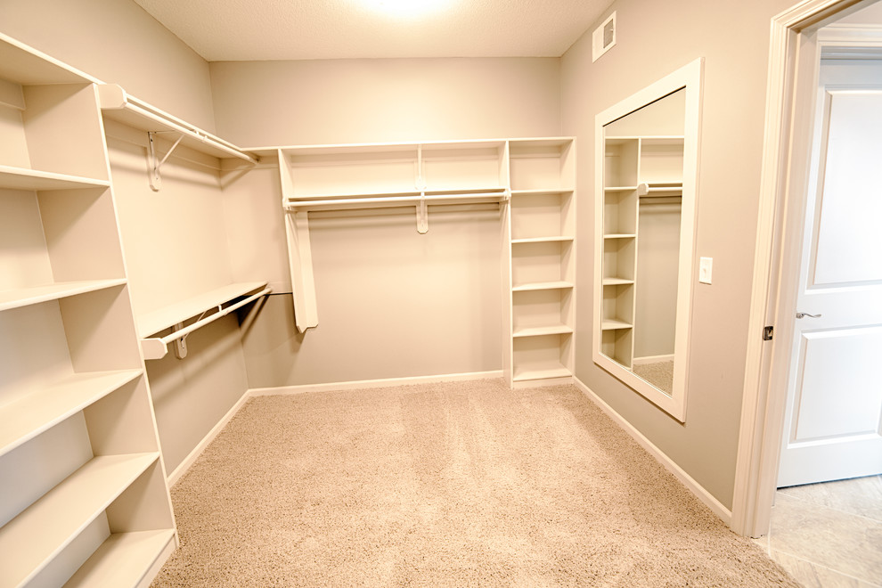 This is an example of a transitional storage and wardrobe in Kansas City.