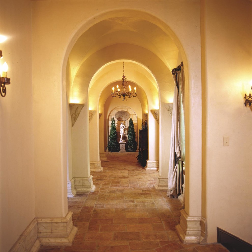Inspiration for a large traditional hallway in New York with beige walls and concrete floors.