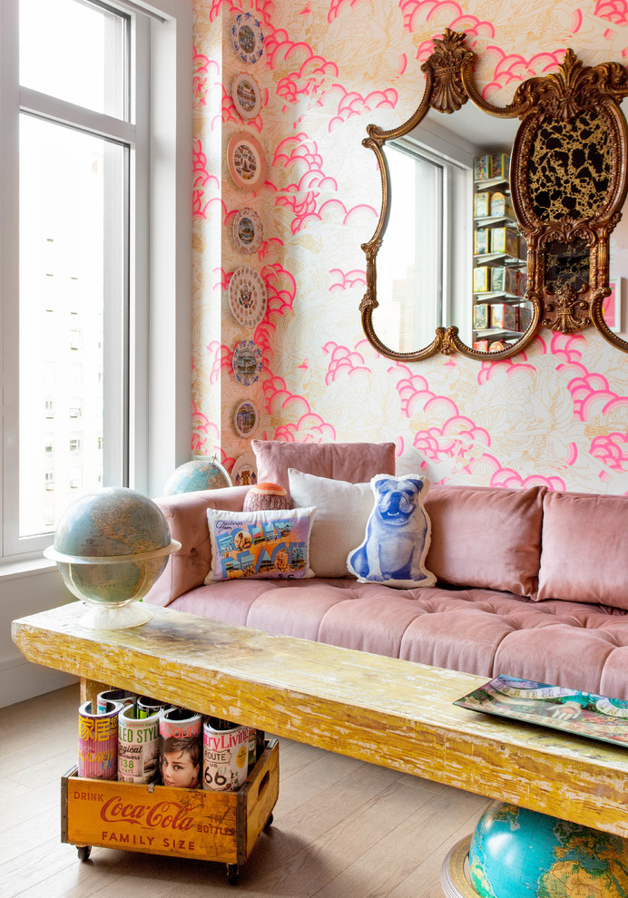 Photo of a mid-sized eclectic open concept family room in New York with pink walls and a wall-mounted tv.