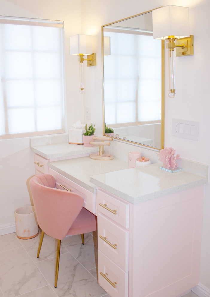 Design ideas for a mid-sized transitional kids bathroom in Orange County with shaker cabinets, white cabinets, a freestanding tub, an open shower, a one-piece toilet, multi-coloured tile, marble, pink walls, ceramic floors, a drop-in sink, quartzite benchtops, multi-coloured floor, a hinged shower door, multi-coloured benchtops, a shower seat, a single vanity, a built-in vanity and wallpaper.