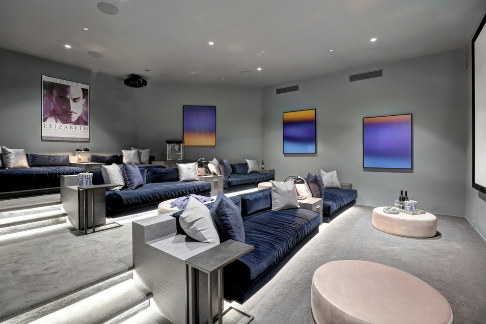 Design ideas for a contemporary enclosed home theatre in Los Angeles with grey walls, carpet, grey floor and a projector screen.