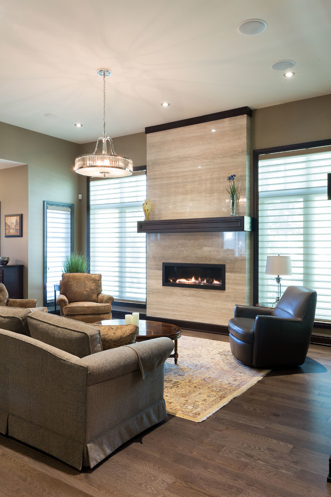 This is an example of a large contemporary open concept living room in Other with beige walls, medium hardwood floors, a ribbon fireplace, a wall-mounted tv and brown floor.